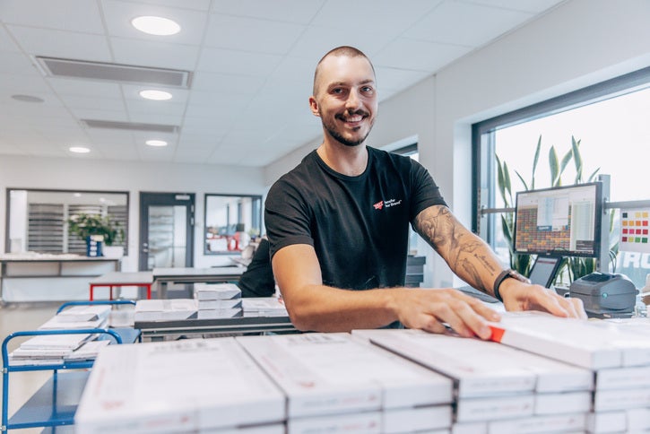 Worker smiling at the dispatch station